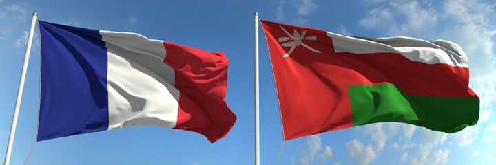 Flying flags of France and Oman on high flagpoles. 3d rendering