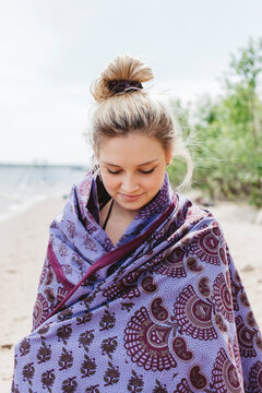 Attractive woman wrapped in blanket