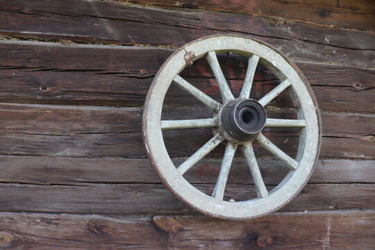 carriage wooden wheel  in rural yard