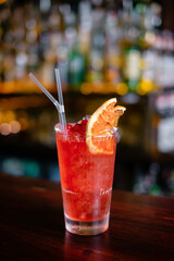 Exotic tropical cocktail with pineapple on the bar counter.