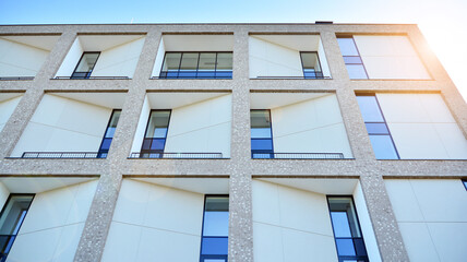 Architectural details of modern apartment building. Modern european residential apartment building complex with sunlight.