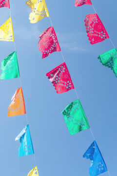 Red, green, blue, yellow flags in the wind