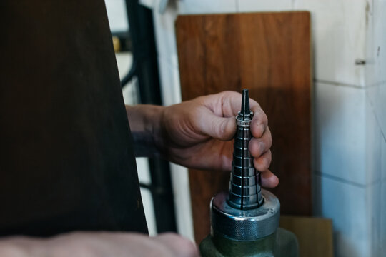 Goldsmith enlarging a ring