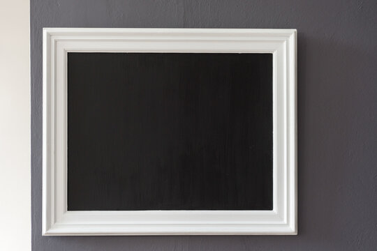 blank blackboard on a wall