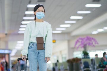Asian travelers girl with medical face mask to protection the Covid-19 in airport