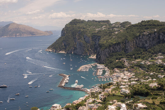 High level shot of Capri island showing harbor and ocean