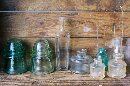 Collection of vintage glass bottles and insulators - horizontal