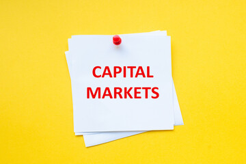 Capital markets. word on white sticker with yellow background