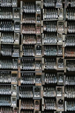 Background of vintage metal numbering inserts for printer - vertical