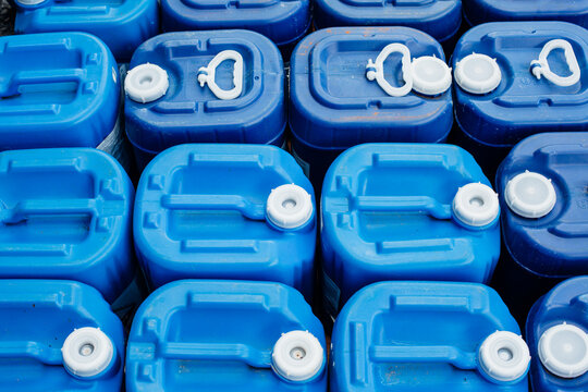A close up of blue chlorine containers.