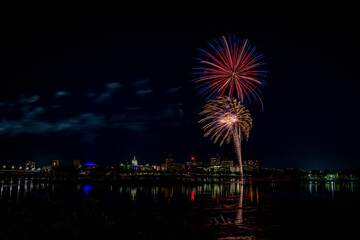 Harrisburg's 104th Kipona Festival 2020 - fireworks are set off from City Island. Here is a view of them and Riverfront Park from across the Susquehanna River. 