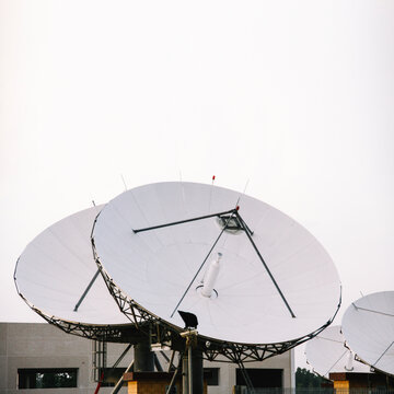 Satellite dish antennas under sky