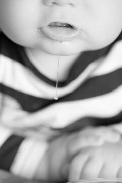 Baby drool caught in mid dribble