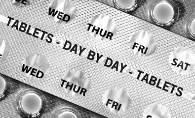 Aluminium strip blister pack tablets with days of week marked in closeup