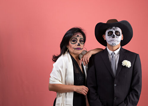 Mexican couple dressed as a catrina and catrin