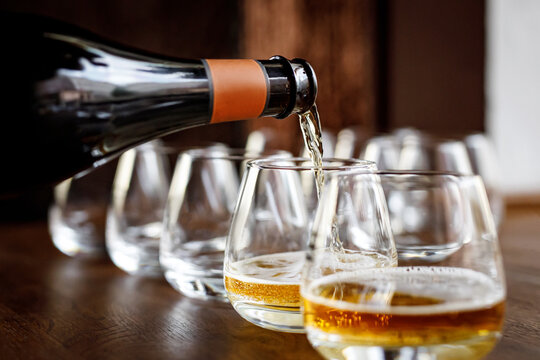 pouring cider into glass