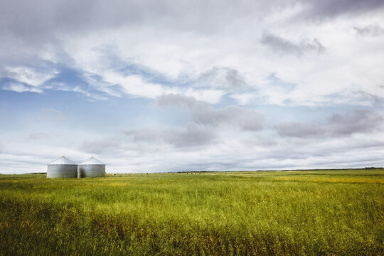 Farm silos on the open prairies