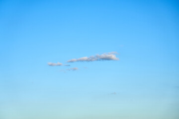A cloud in clear blue sky.