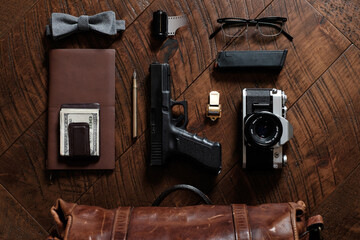 The contents of a man's briefcase laid out on a wood table