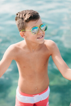 Boy sun bathing on the beach