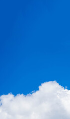 Blue sky background with a cloud at the bottom