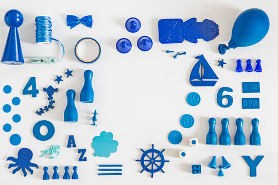 Collection of blue toys and game pieces