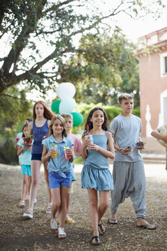 Group of children preparing a party in a yard