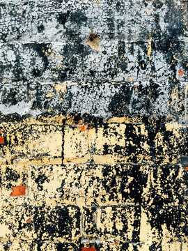 Close up of paint on old brick wall