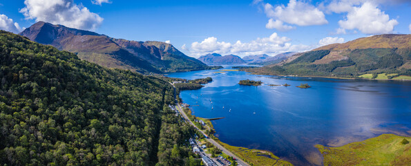 Naklejka na ściany i meble aerial view of loch linnhe in summer near duror and ballachulish and glencoe in the argyll region of the highlands of scotland showing blue water and green fertile coast line