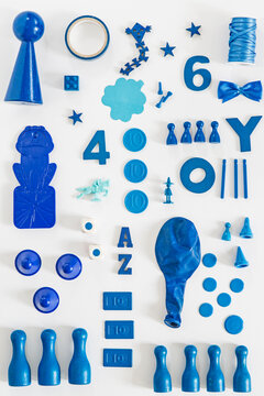 Collection of blue toys and game pieces