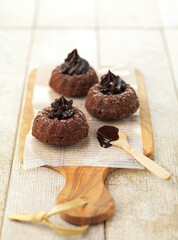 Chocolate cream fruit gugelhupf cake on wooden plate