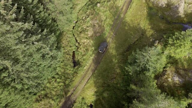 ATV All Terrain Vehicle Driving Through a Forest