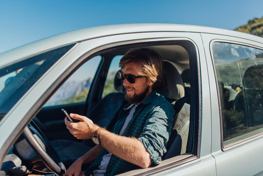 Man using a mobile phone in the car