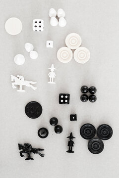 Black and white game pieces on grey background