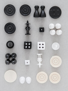 Black and white game pieces on grey background