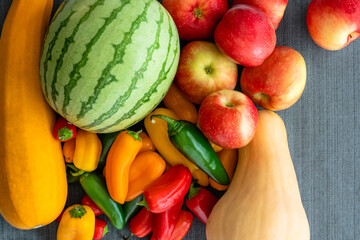 Watermelon, zucchini, squash, apples and bell peppers. Fruits and vegetables close up, view from above