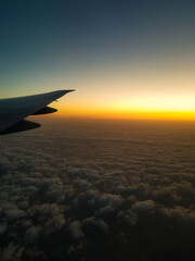 airplane in the sky at sunset