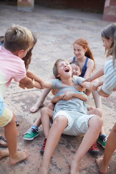 Great moment of fun with a group of children playing together