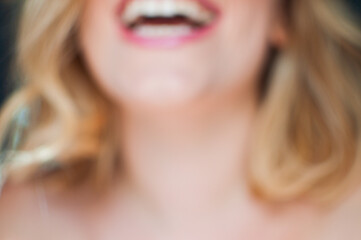 An out of focus woman laughing