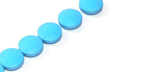 Pharmacology concept, blue pills on white isolated background, line shape, horizontal banner