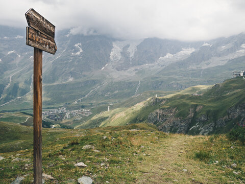 Wooden sign on the mountains