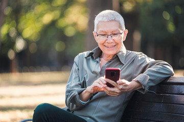 Senior old woman sending love and kisses to her family over social media