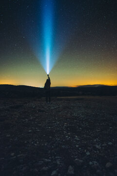woman is looking stars with light