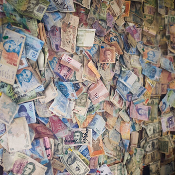 A wall full of money from all over the world