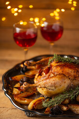 Part of the Christmas turkey with two glasses with red wine background. Festive mood. Holiday concept.