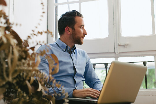 Entrepreneur man using his laptop at office.