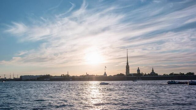 Timelapse video of Peter and Paul fortress in white nights time, boats and ferries pass along the Neva river, St. Petersburg, Russia
