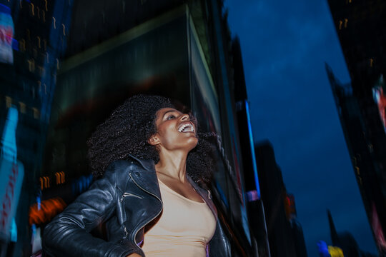 Cheerful Latin American Afro Woman in the Street