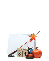 Wooden calendar October 31 with halloween decoration on a white background