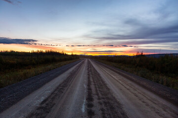 Fototapeta na wymiar View of Scenic Road leading to Tombstone at Sunrise in Canadian Nature. Dempster Highway, Yukon, Canada.